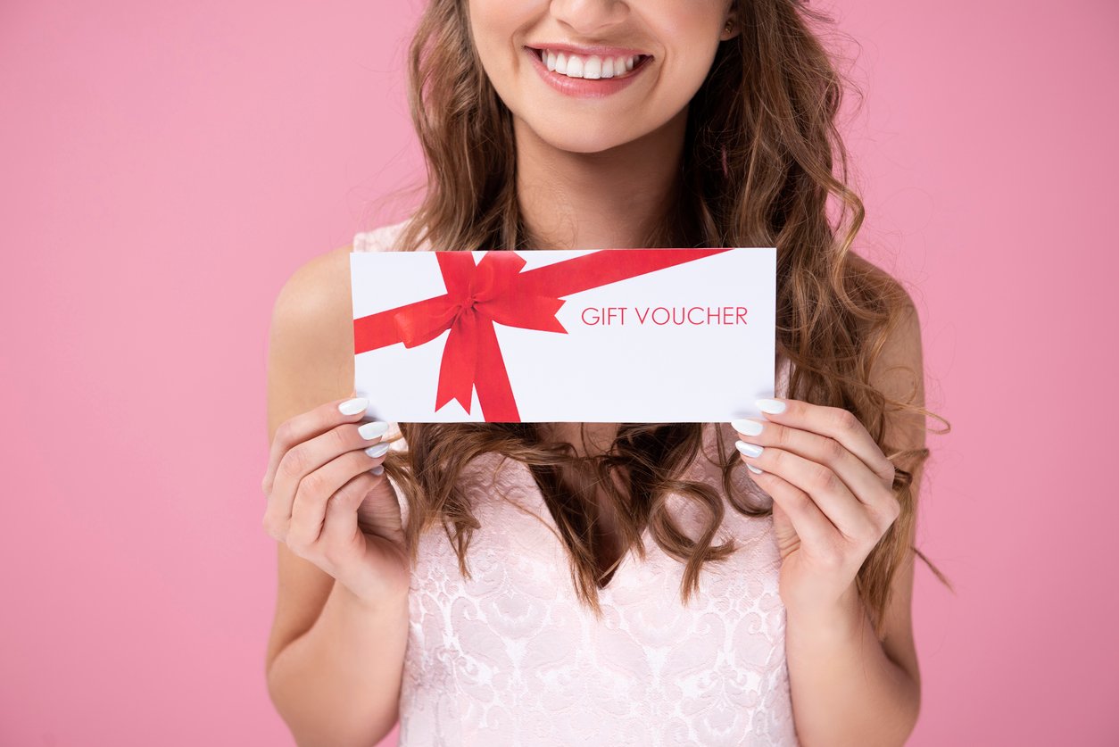 girl-holding-printed-gift-voucher